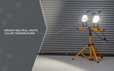 Dual Head LED Work Light On Steel Tripod, 6000 Lumens, 72W, 4000K Neutral White, shown illuminated in rugged orange and black.