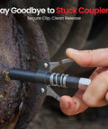 Close-up of a hand attaching the Beefy 10000 PSI Cordless Grease Gun Kit With Dual Batteries 39.4 Inch Hose Three Couplers LED Light Auto Pumping Mode For Automotive Farm Truck And Trailer Maintenance coupler to a machine.