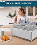 Festisoul 22Qt Double Commercial Electric Deep Fryer, 3400W Powerful Heating System With Stainless Steel Construction, XL Baskets And Lids Featuring Built In Oil Filtration For Restaurant, Catering And Food Truck Use in a kitchen setting with fried chicken.