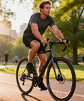 Cyclist riding on a park trail at sunset