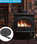 Front view of a black wood stove with fire; inset shows graphite fiberglass gasket rope, 3/4x1/8x118 in.
