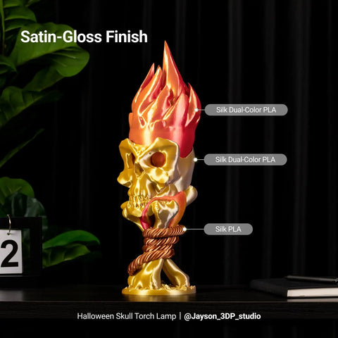 Premium Silk PLA 3D Printer Filament 1.75Mm 2.2 Pound Spool features a shiny dual-color skull lamp with flame highlights.