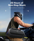 Man on motorcycle holding Boom 2 Plus Portable Speaker With 140W BassUp 2.0, 20 Hour Playtime, Fast Charge, IPX7 Waterproof