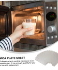 Hand placing glass in microwave with 12 Pack Mica Sheets For Microwave Oven Heat Resistant Insulation, Fire Retardant Waveguide Covers inset