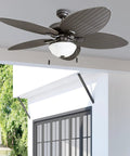 Inland Breeze Tropical 52 Inch Indoor Outdoor Ceiling Fan With Light, Five Blades, Reversible Motor, Bronze Finish on porch ceiling.