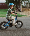 Child riding a blue 16 inch kids bike for ages 4 and up, BMX style youth bicycle with training wheels, coaster brake and rear V brake