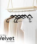 Velvet Hangers 20 Pack Non Slip Next Level With Tie Bar Black Slim Hangers holding clothes on a rack.