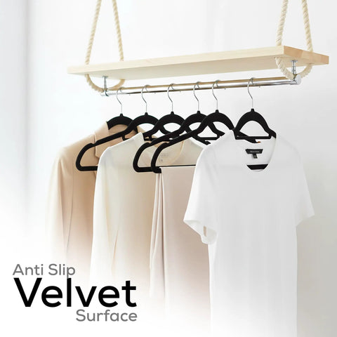 Velvet Hangers 20 Pack Non Slip Next Level With Tie Bar Black Slim Hangers holding clothes on a rack.