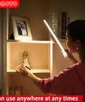 Person using 84 LED Motion Sensor Closet Light 4W Rechargeable under cabinet wardobe lighting 4000K in a shelf
