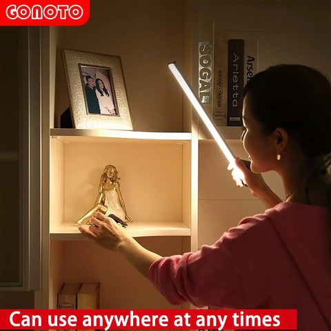 Person using 84 LED Motion Sensor Closet Light 4W Rechargeable under cabinet wardobe lighting 4000K in a shelf