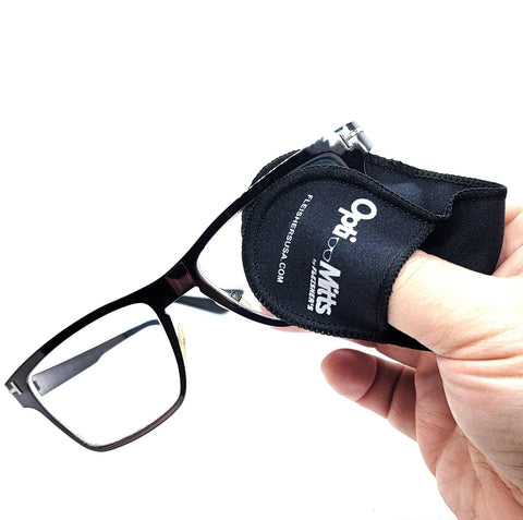 Fleisher's Opti-Mitts eyeglass cleaning finger mitt, side view, worn on hand cleaning black glasses