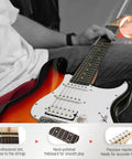 Playing the 39 Inch Full Size Electric Guitar Kit Sunburst with Amplifier Gig Bag Capo Strap Extra Strings Tuner Cable Picks And HSS Pickups, close-up view of fretboard.