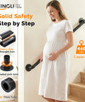 Rock Solid 3 Foot Adjustable Pipe Handrail For Indoor Outdoor Stairs Heavy Duty Wall Mounted Metal Safety Grab Bar Supporting 440 Lbs. A pregnant woman holds the black wrought iron handrail while descending stairs.