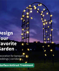 Illuminated sturdy black wrought iron pergola arbor garden arch with ground spikes 100 inches high and 45 inches wide at night