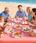 Heavy Duty Crab Boil Paper Plates, 9 Inch Disposable Party Platter Set used at beach feast with seafood and gathering.