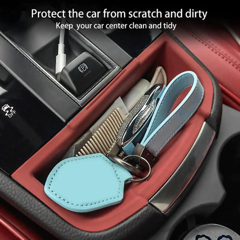 Porsche Macan Center Console Organizer Tray 2 Piece Set Silicone Cup Holder Storage Protective Pad for 2022-2026 with items inside