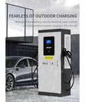 Beefy 120kW DC Fast EV Charger With Dual CCS Connectors, Multi Power Options, Level 3 Commercial Charging Station in rain
