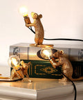 Three Style Resin Mouse Desk Lamp With LED Glow featuring running, sitting, and standing gold mice on books, plug-in light decor.
