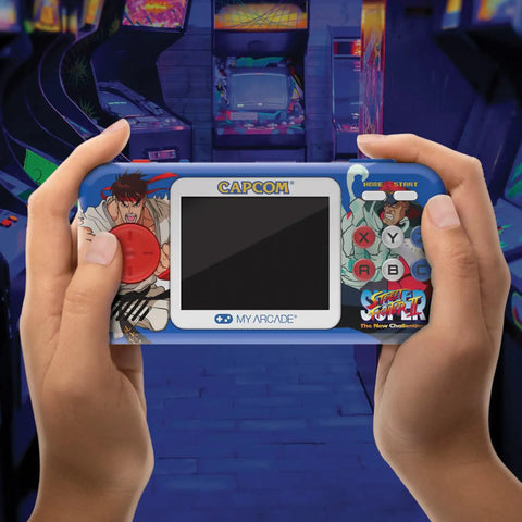 Hands holding Street Fighter II Pocket Player Pro Handheld Console 2 In 1 Capcom Licensed Classics For Retro Gaming Fans