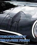 Close-up of a black car hood showing the hydrophobic effect with droplets, demonstrating Two Pack Quick Effect Car Coating Spray 2026 Upgrade With Three In One Shine Care.
