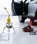 Rock Solid Hydraulic Bearing Puller Kit 20 Ton 44092 Lb Pulling Force used in an auto repair shop with car and bearings.