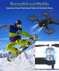 4K HD FPV Mini Drone With Camera For Beginners, Brushless Motors hovering over snowboarder in snowy mountain backdrop