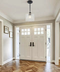 BOKUNOFU Glass Pendant Light Kitchen Island hanging above entryway, featuring hammered glass shade and black metal finish.