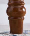Close-up of retro brown computer desk leg showing sturdy construction and timber material, ideal support for workspace setup.