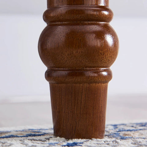 Close-up of retro brown computer desk leg showing sturdy construction and timber material, ideal support for workspace setup.