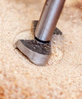 Forstner drill bit, gray metal, woodworking tool drilling into wood close-up