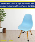 Heavy Duty Tennis Ball Chair Glides For Slick Smooth Floor Savers No Scratch Guards Easy Install Pre Cut Felt Pads Zero Hassle Furniture Foot Covers Stool And Patio Leg Caps 100 Pack on a light blue chair in a modern interior.