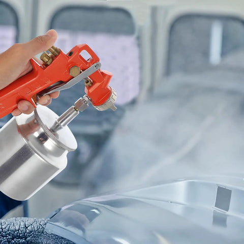 Handheld Slick Pneumatic Paint Sprayer Set For Car Body and Interior, spraying smooth paint finish on a car surface.