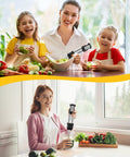 Woman and children using Six In One Immersion Blender With 1000W Motor And 12 Speed Settings Includes 600ml Beaker And 500ml Chopper