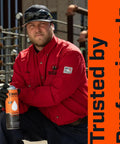 Worker holding rust penetrant spray in industrial setting, emphasizing trusted by professionals