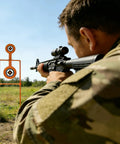 Shooter aiming at Double Spinner Auto Reset Steel Target For Handguns Up To.44 Magnum With 3.5 Inch And 4.5 Inch Targets