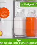 32 Oz Glass Milk And Juice Bottle Set With No Leak Airtight Screw Lid And Silicone Gasket in refrigerator, scale mark visible