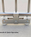 Stainless Steel Sliding Gate Wheel With V Groove Roller For Beefy Heavy Duty Gates And Garage Doors Smooth Ball Bearing Track Roller Industrial Caster Pulley Kit Rolling Gate Hardware For Reliable Quiet Operation shown installed on a gate.