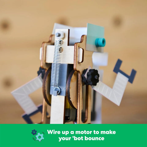 Jumping Robot STEM Kit Building Set For Kids Ages 9 And Up Learn Real World Science And Engineering As You Build Customize And Tweak Jump Performance And Look Totally Dope Science Gift wooden spring-powered robot close-up