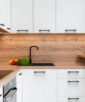 Matte Black Cabinet Pulls 5 Inch Center To Center Zinc Alloy Kitchen Cabinet Handles 10 Pack installed on white cabinets.