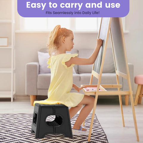 Child uses Folding Step Stool Nine Inch Holds Up To 600 Lb With Non Slip Surface in living room, sitting on black stool drawing.