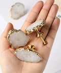 Hand holding Geode Crystal Cabinet Knobs 4 Pack With Dope Gold Plated Gemstone Drawer Pulls For Kitchen Cabinets Dressers
