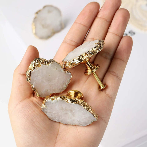 Hand holding Geode Crystal Cabinet Knobs 4 Pack With Dope Gold Plated Gemstone Drawer Pulls For Kitchen Cabinets Dressers