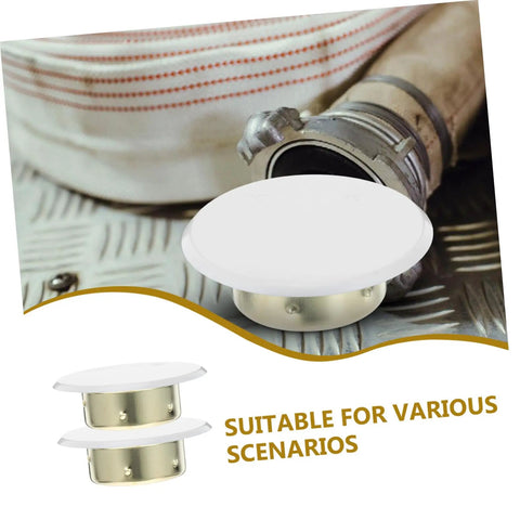 Four Pack Concealed Sprinkler Head Decorative Covers Heavy Duty Iron Protective Plates Built Tough For Outdoor Lawn Irrigation Systems on metal surface.