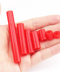 Heavy Duty Outlet Spacers And Screw Mount Kit Featuring Top Shelf Silicone And Corrosion Resistant Steel Build For A Quick Six Thirty Two Thread Fit That Makes Rough Electrical Jobs Sweet And Simple, red silicone spacers displayed in hand.