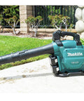 Game Changing Cordless Leaf Blower Kit Equipped With A Brushless Motor Pumping 473 CFM And 120 MPH Air With Zero Hassle Cruise Control And Rapid Swap Batteries For Knocking Down Piles And Hauling Leaves Straight on a garden surface.