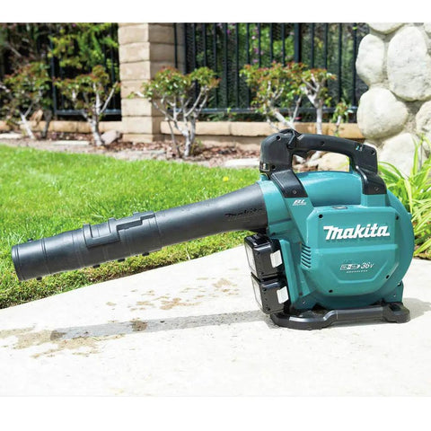 Game Changing Cordless Leaf Blower Kit Equipped With A Brushless Motor Pumping 473 CFM And 120 MPH Air With Zero Hassle Cruise Control And Rapid Swap Batteries For Knocking Down Piles And Hauling Leaves Straight on a garden surface.