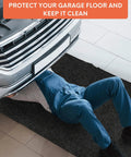 Mechanic under car on heavy duty oil spill mat for driveways and garages, 17 by 7.9 feet, reusable absorbent polyester pad.