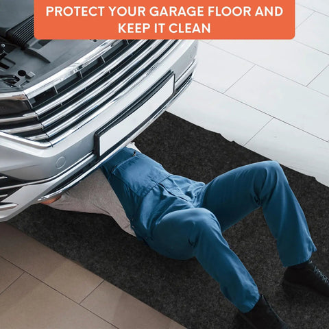 Mechanic under car on heavy duty oil spill mat for driveways and garages, 17 by 7.9 feet, reusable absorbent polyester pad.