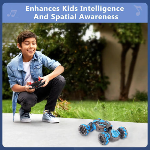Boy playing with Sensing RC Stunt Car For Kids With 2.4GHz Hand Remote outdoors on pavement