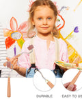 Professional Heavy Duty Rubber Ink Roller For Printmaking And Canvas Painting Smooth Glide Surface held by a child with a paint palette.